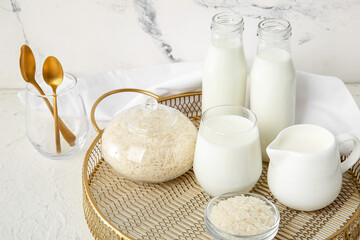 Tray with healthy rice milk on white background