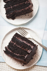 Chocolate layered cake. Dark chocolate cake made on buttermilk and cola