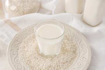Glass of rice milk on table