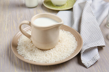 Jug of rice milk on table