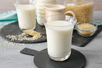 Glass of rice milk on table