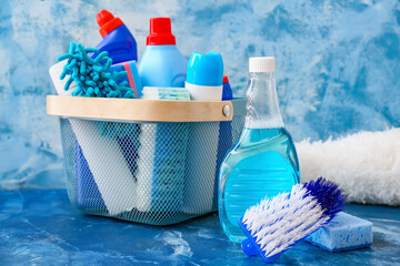 Set of cleaning supplies on color background