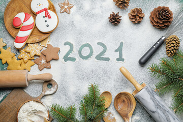 Tasty Christmas cookies, utensils and text 2021 on light background