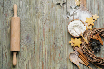 Fototapeta na wymiar Ingredients, cookies and rolling pin on wooden background