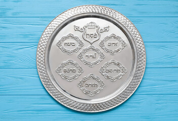 Passover Seder plate on color wooden background