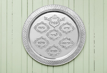 Passover Seder plate on color wooden background