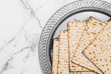 Passover Seder plate with matzo on white background