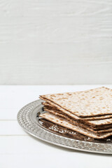 Passover Seder plate with matzo on table, closeup