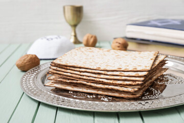 Passover Seder plate with matzo on table, closeup