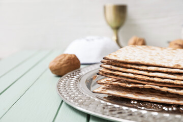 Passover Seder plate with matzo on table, closeup