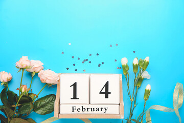 Calendar with date of Valentines Day and rose flowers on color background