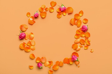 Frame made of beautiful rose flowers on color background