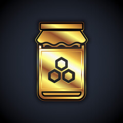Gold Jar of honey icon isolated on black background. Food bank. Sweet natural food symbol. Vector.
