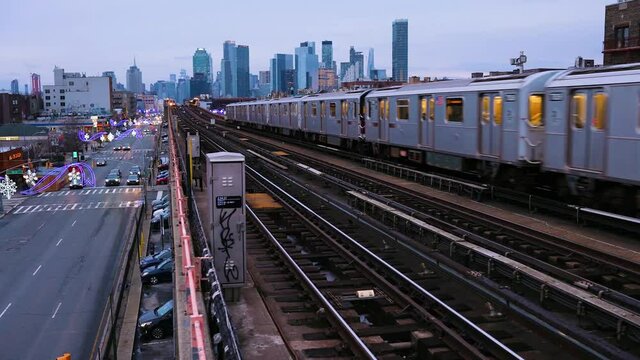 Train arriving to a metro station in Brooklyn New York on a sunny summer day