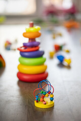 Toys are scattered on the floor