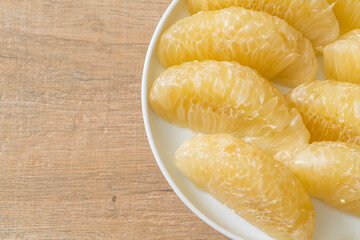 Fresh peeled pomelo, grapefruit or shaddock