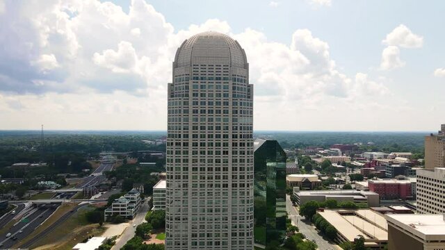 Aerial of Wells Fargo Center Building in Downtown Winston-Salem, North Carolina USA. Postmoden Skyscraper and City Skyline 60fps
