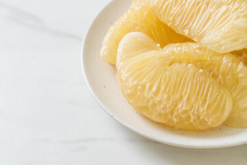 Fresh peeled pomelo, grapefruit or shaddock