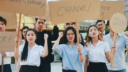 Group of asian protester against government corruption. Raise banner to show purpose from people in the city.