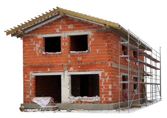 Unfinished building of a red brick rural house in the winter isolated