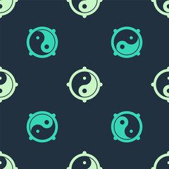 Green and beige Yin Yang symbol of harmony and balance icon isolated seamless pattern on blue background. Vector.