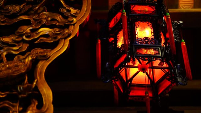 Chinese red lantern rotates in a Buddhist temple near the city of Danang, Vietnam. Close up