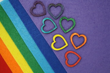 Wooden hearts on multi-colored felt.