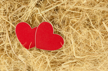 image of two hearts in hay as a symbol of love close-up © vadim yerofeyev