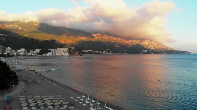 Sunset over the beach in Becici sea view, Budva, Montenegro. 4K video