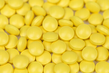 Medicine background of yellow painkillers