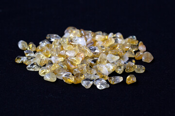 Citrine yellow gem geode crystals geological mineral on black background close up