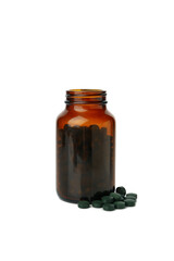 Medical bottle with spirulina pills isolated on white background