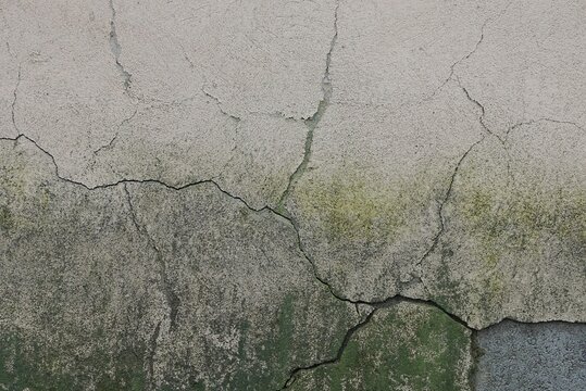 gray green stone texture from old dirty concrete wall and cracks