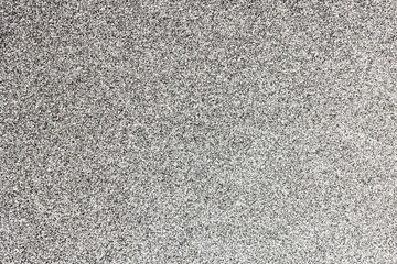 Grunge distressed splatter background spray paint drops. Black ink splashes on white paper.