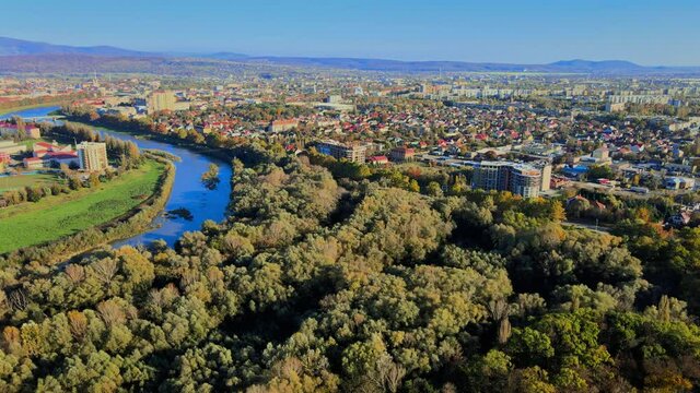 Panoramic view on a small city at above in the autumn over the Uzh River Uzhhorod Ukraine Europe