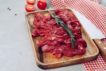 Raw beef meat fillet on wooden board