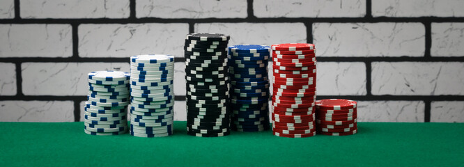 beautiful concept of poker chips on green table, long photo