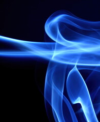 Bluish-gray Smoke in an abstract design against black background.
