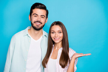 Portrait of positive persons toothy smile lady arm hold empty space object isolated on blue color...