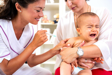 Little boy receiving a vaccine shot