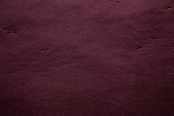 Wine red colored background with textures of different shades of wine red or plum color