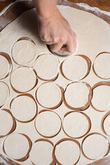Dumplings making process, dough and minced meat