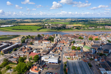 Aerial photo of the beautiful town of King's Lynn a seaport and market town in Norfolk, England UK showing the main town centre along side the River Great Ouse on a sunny summers day © Duncan
