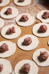 Dumplings making process, dough and minced meat