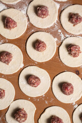 Dumplings making process, dough and minced meat
