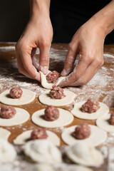 Dumplings making process, dough and minced meat
