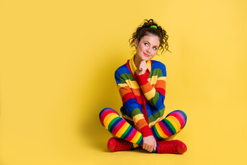 Full body photo of girl sit floor look copyspace think thoughts isolated over bright shine color background
