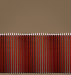 Pattern of brown pencils at grey background