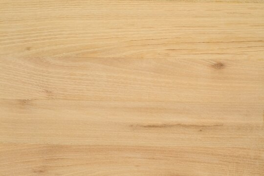 Acacia natural wooden desk without paint or  varnish.  Wood texture background made from locust tree.
