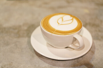 Cup of coffee with latte art pattern